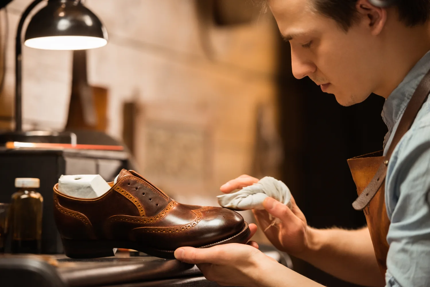 concentrated-shoemaker-workshop-making-shoes